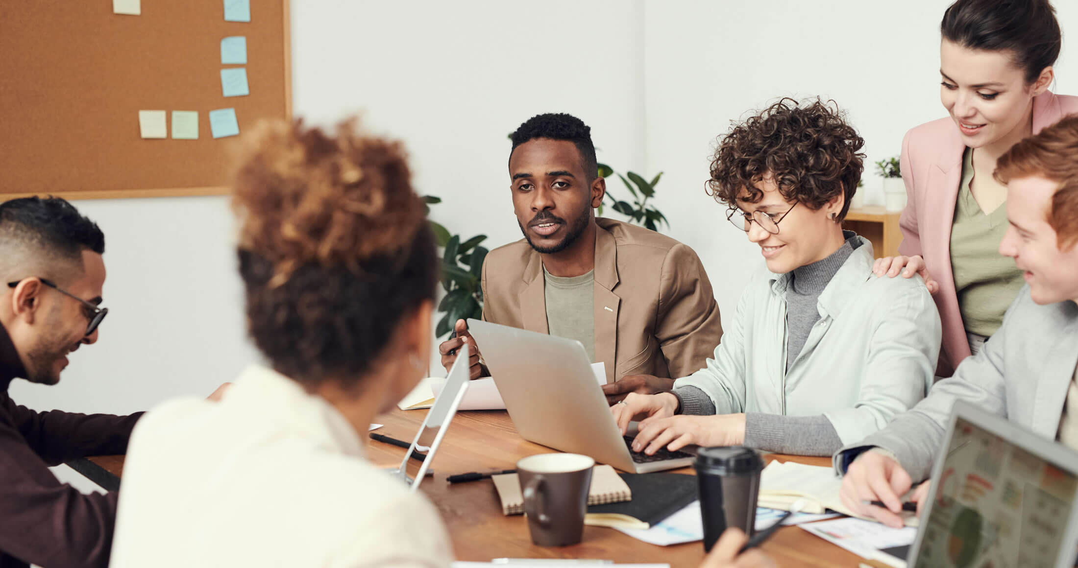 People in discussions around a table